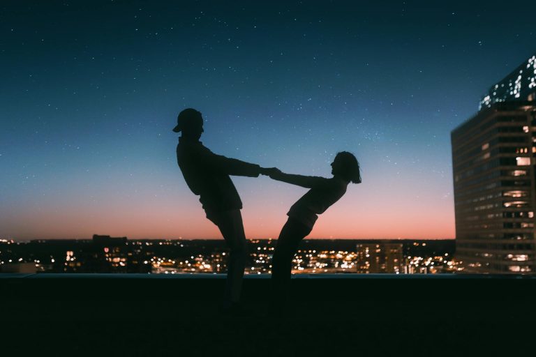 Couple enjoying a city nightscape how to help someone with a porn addiction